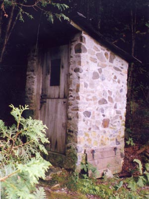 Nearing House: Slipform Stone Outhouse.