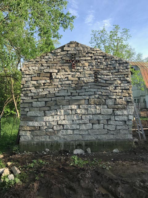 The recycled concrete stone wall looks like real stone.