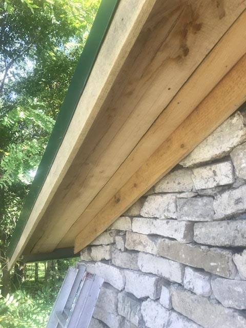 Adding trim along the stonework.