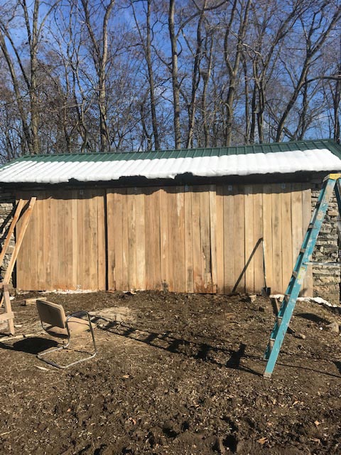 There are three sliding doors on each side of the barn.