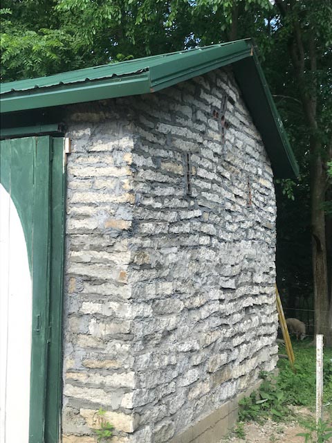The grouted stonework looks similar to natural slabs of limestone.