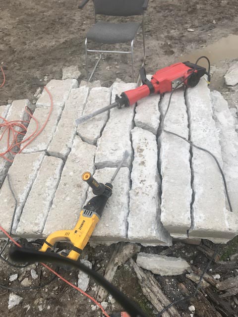 A concrete slab split into many stones.