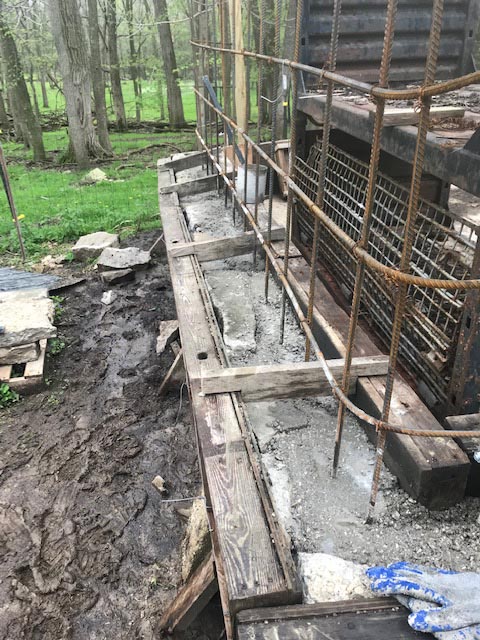The first level of slipforms were filled with stone and concrete.
