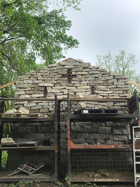 Recycled concrete slab stonework was finished to the peak.