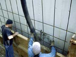 Rehl House: Pouring concrete backwall.
