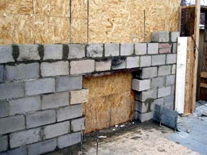Cinderblock for wall behind masonry fireplace.