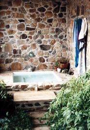 Slipform Stone Hot Tub in Greenhouse.