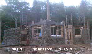 Slipform stone masonry first level.