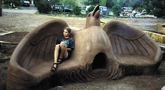 Eagle-shaped earth oven and bench.
