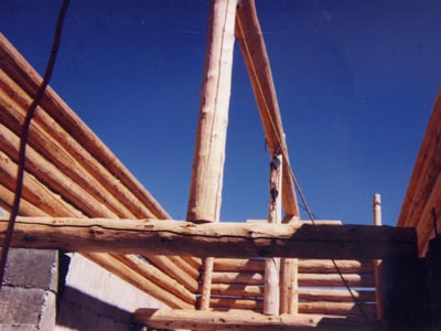Post and beam construction with round logs.