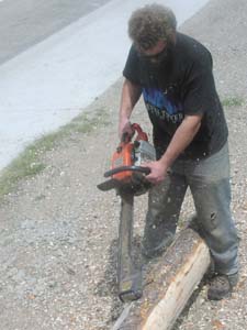 Peeling logs with a Log Wizard.