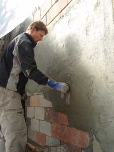 Stucco over cinderblock.