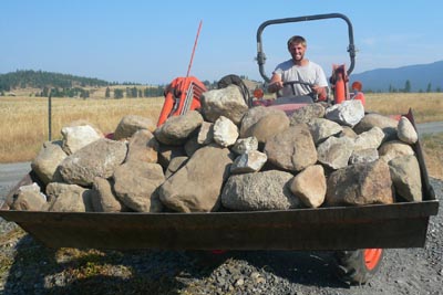Tractor bucket of free rocks from farm.