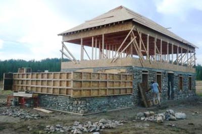Slipform stone addition and second story frame.