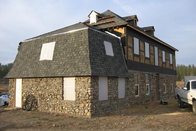 Sealing up house for winter with windows and plastic.